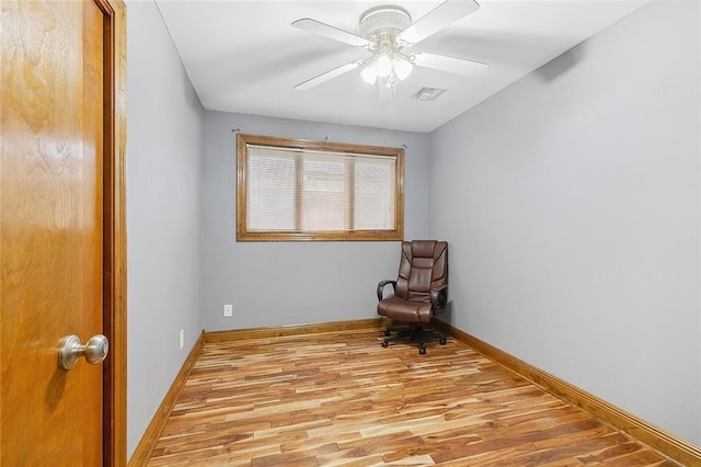 unfurnished room featuring ceiling fan and light wood-type flooring