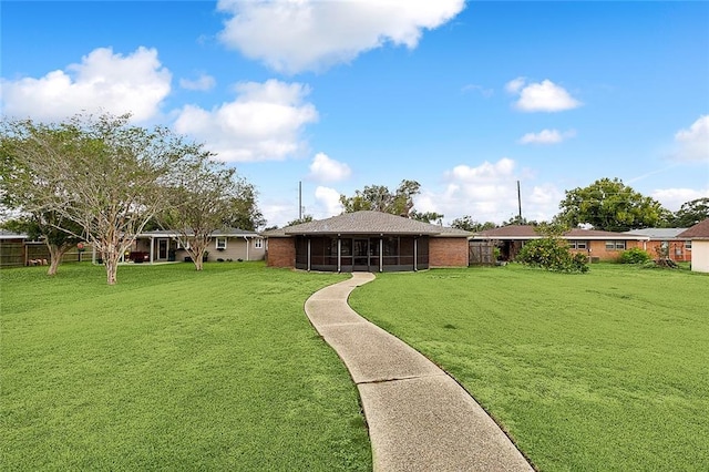 view of yard featuring a sunroom