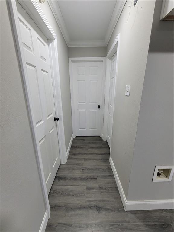 hall featuring ornamental molding and dark hardwood / wood-style floors