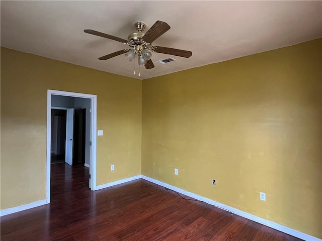 unfurnished room featuring ceiling fan and dark hardwood / wood-style flooring