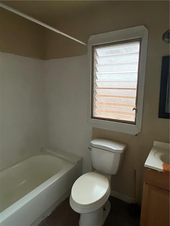 full bathroom with vanity, bathtub / shower combination, and toilet