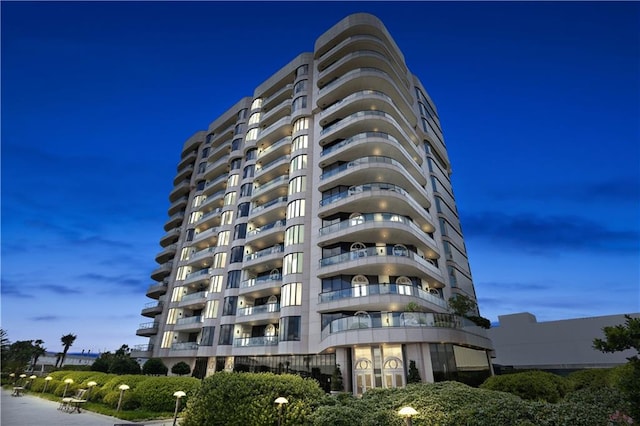 view of outdoor building at dusk