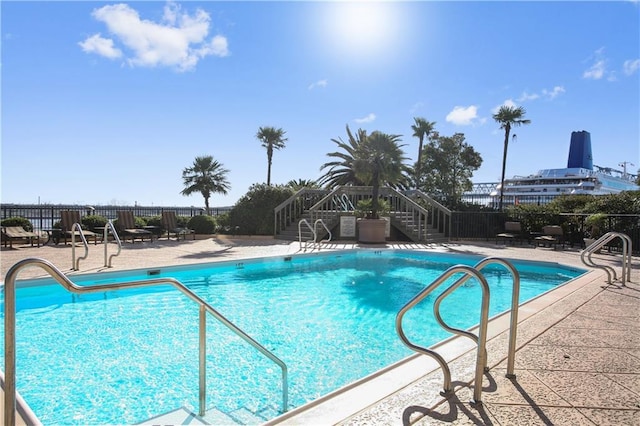 view of swimming pool with a patio