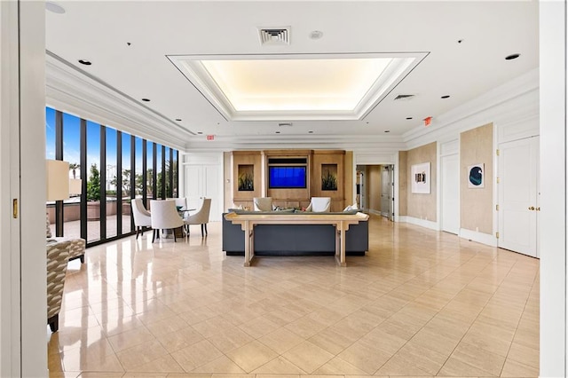 living room with a tray ceiling