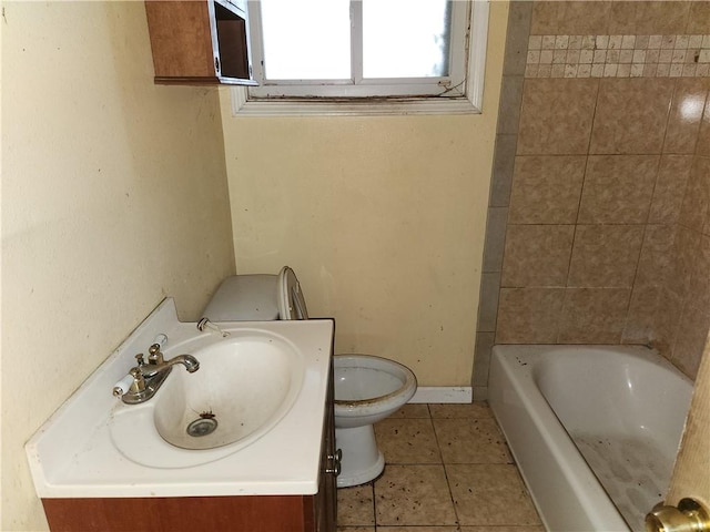 bathroom with toilet, tile floors, and vanity