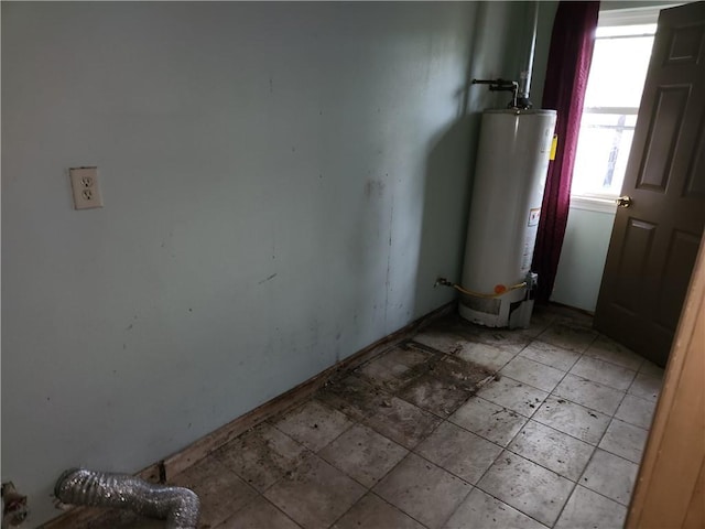 utility room featuring gas water heater