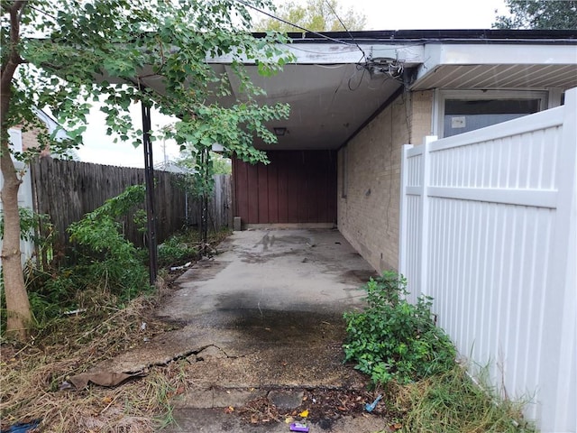 view of property exterior with a carport