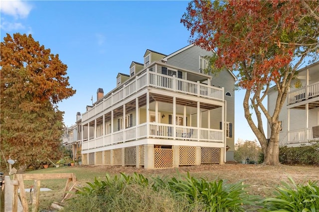 view of front of house featuring a balcony