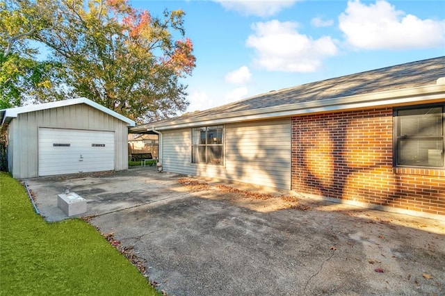 view of side of home with a yard and a garage