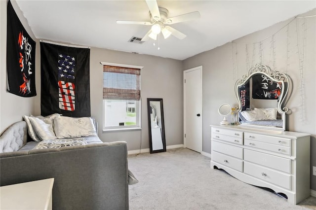 bedroom with light carpet and ceiling fan