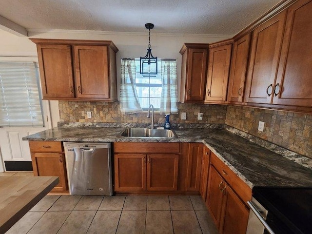 kitchen with dishwasher, dark stone counters, decorative light fixtures, backsplash, and sink