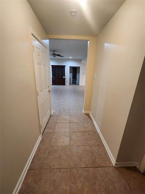 hall featuring tile patterned flooring