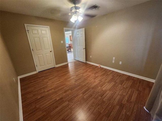 unfurnished bedroom featuring ceiling fan and wood-type flooring