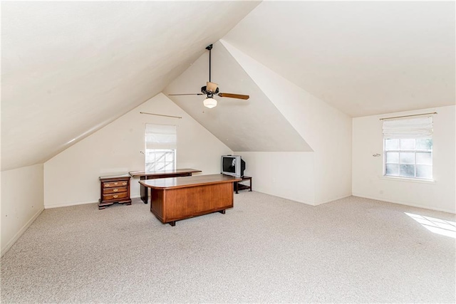 additional living space with vaulted ceiling, plenty of natural light, and light colored carpet