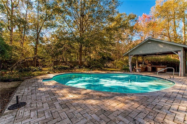 view of swimming pool featuring a gazebo and a patio