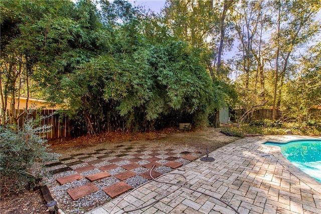 view of patio featuring a fenced in pool