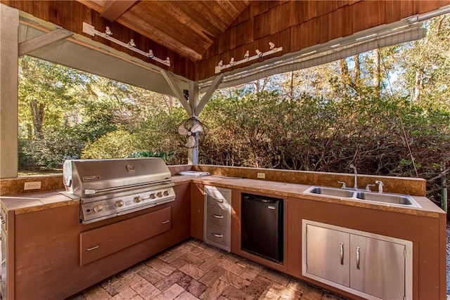 view of patio / terrace with sink, a grill, and exterior kitchen