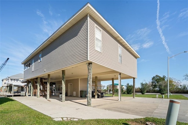 back of property featuring a carport