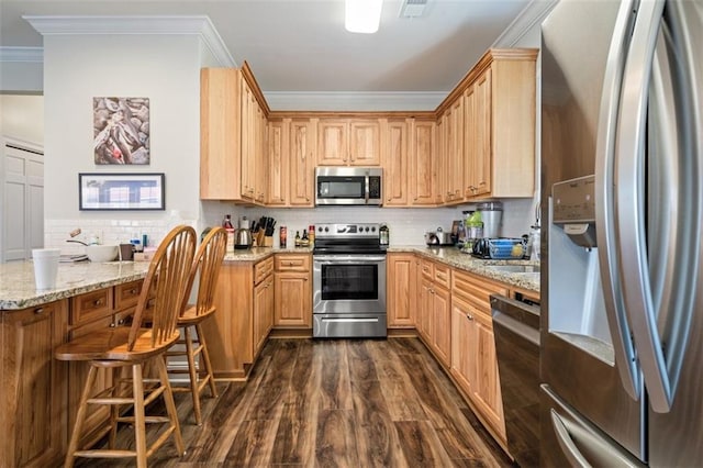 kitchen featuring light stone counters, tasteful backsplash, crown molding, dark hardwood / wood-style floors, and stainless steel appliances