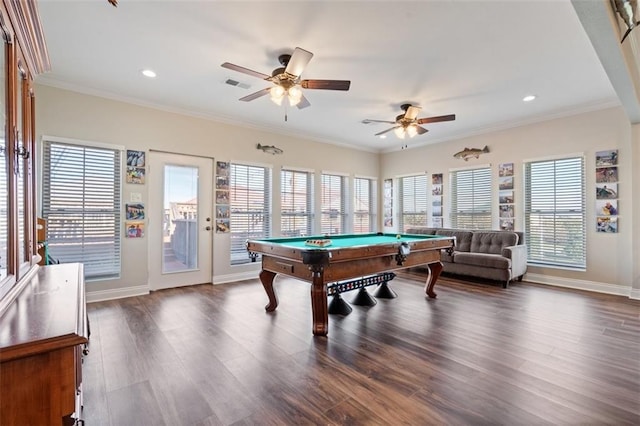 playroom with dark hardwood / wood-style flooring, crown molding, and plenty of natural light