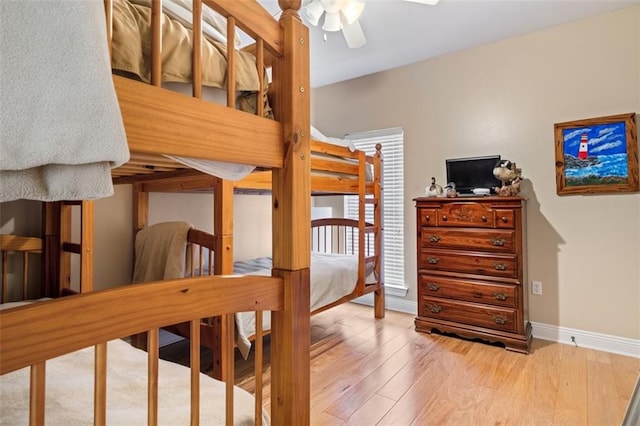 bedroom with ceiling fan and light hardwood / wood-style floors