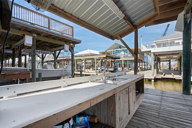 view of dock featuring a water view and sink