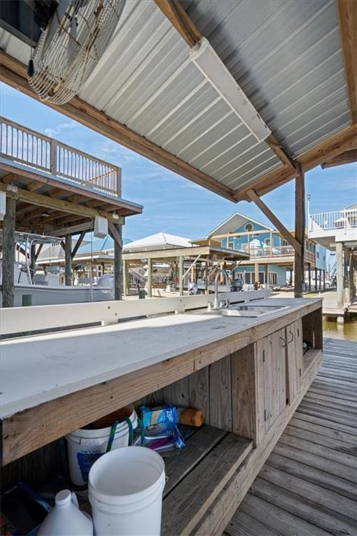 view of dock with a water view and sink