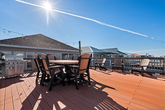 wooden deck featuring grilling area