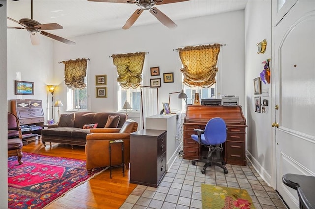 office with ceiling fan and light tile patterned flooring