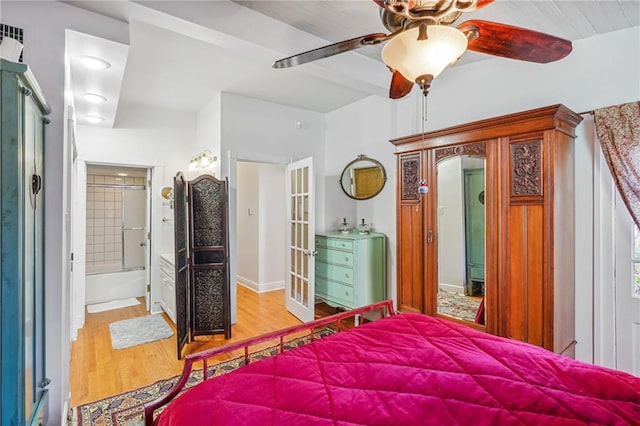 bedroom with wood-type flooring, french doors, ceiling fan, and ensuite bathroom