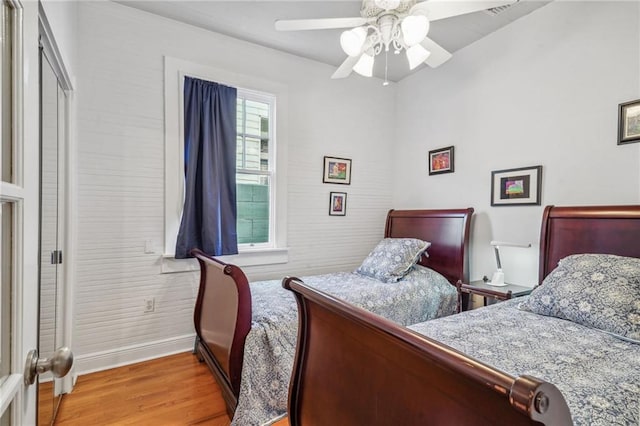 bedroom featuring light hardwood / wood-style flooring and ceiling fan