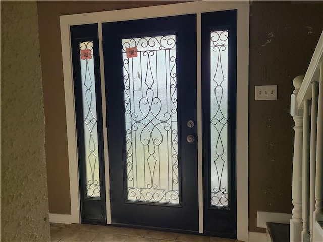 entryway with light tile floors