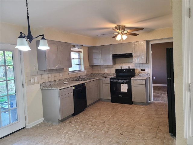 kitchen with ceiling fan with notable chandelier, tasteful backsplash, pendant lighting, and black appliances