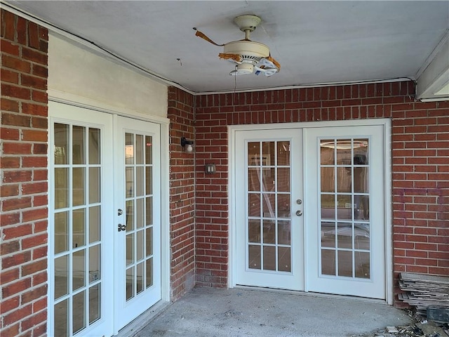 entrance to property featuring french doors and ceiling fan