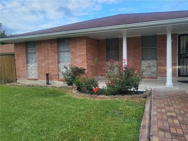 exterior space with a yard and a porch