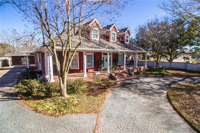 cape cod house with a porch