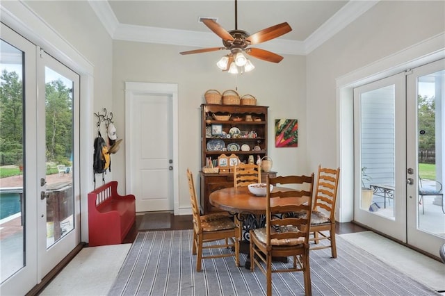 dining room with ceiling fan, a healthy amount of sunlight, and french doors