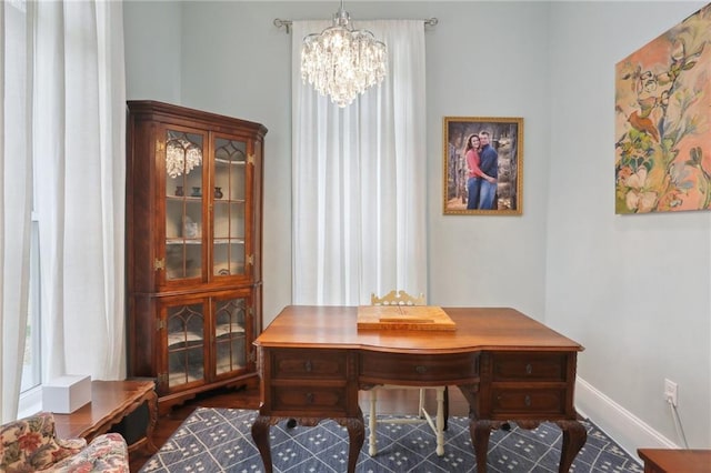 office area with a chandelier and dark hardwood / wood-style floors