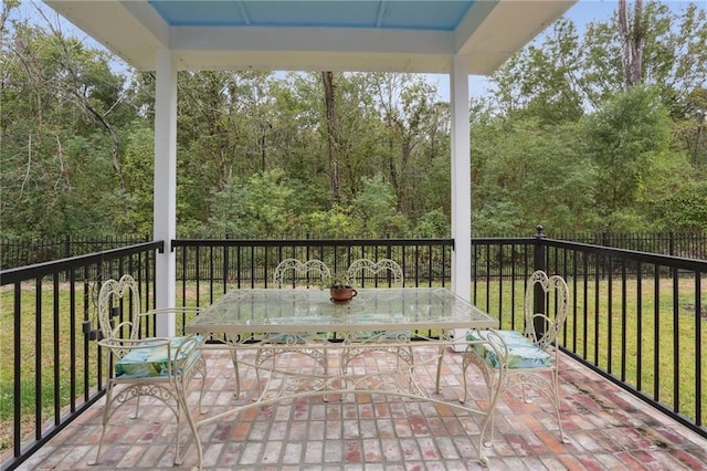 deck featuring a yard and a patio