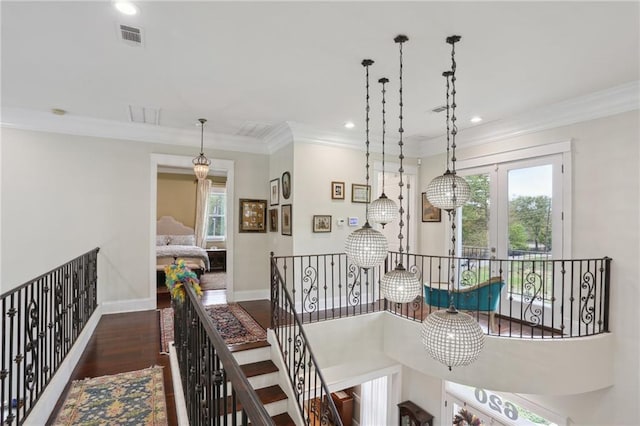 dining space featuring crown molding and dark wood-type flooring