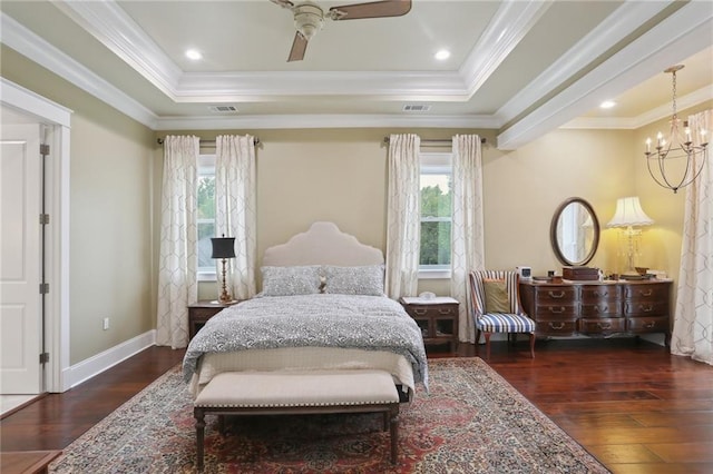 bedroom featuring ceiling fan with notable chandelier, dark hardwood / wood-style floors, a raised ceiling, and crown molding