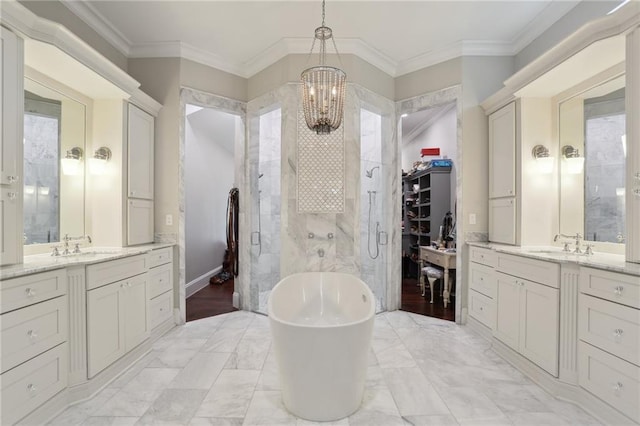 bathroom with vanity with extensive cabinet space, an inviting chandelier, tile floors, and crown molding