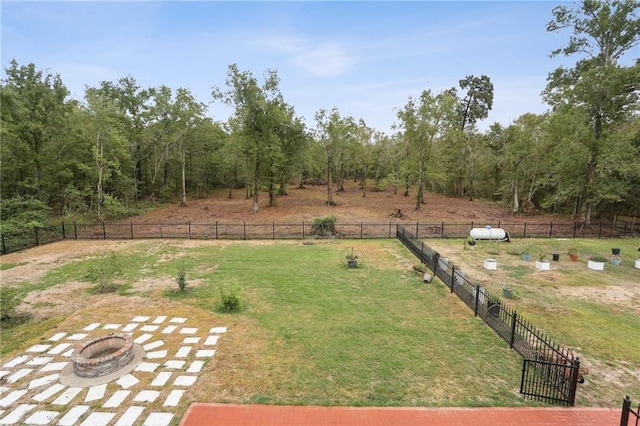 view of yard with a fire pit