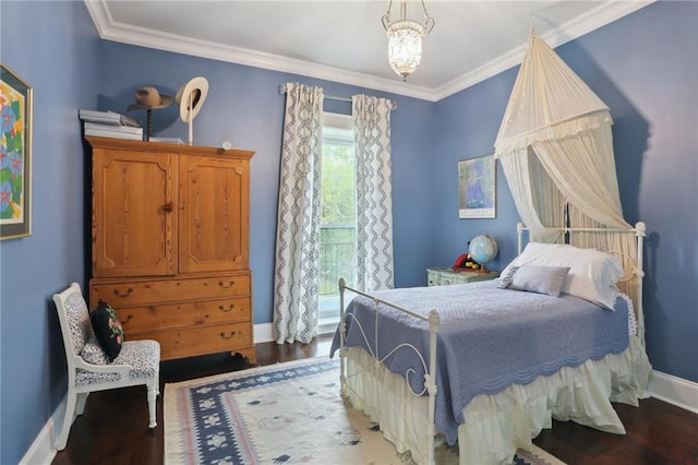 bedroom with a notable chandelier, crown molding, and dark hardwood / wood-style floors