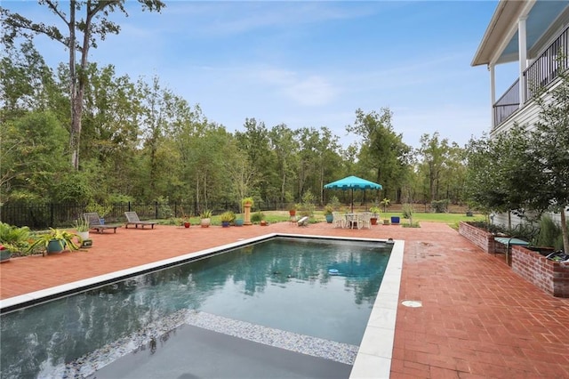 view of swimming pool featuring a patio area