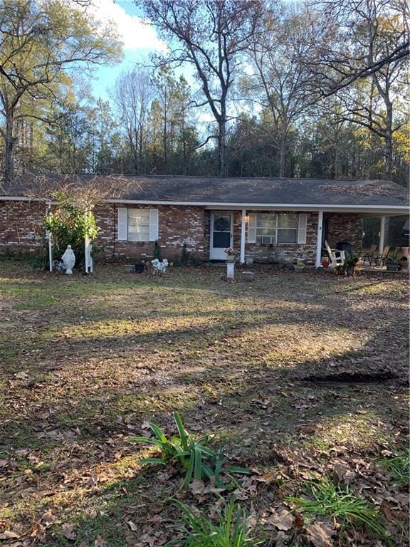 5978 Perryman Ln, Osyka, MS 39657 - ranch-style home with covered porch and a carport