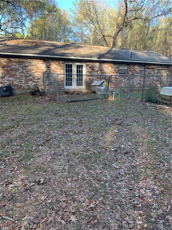 5978 Perryman Ln, Osyka, MS 39657 - back of property featuring brick siding and fence