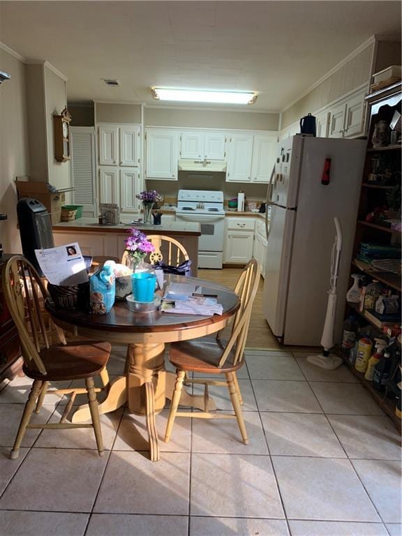 5978 Perryman Ln, Osyka, MS 39657 - dining room with ornamental molding, visible vents, and light tile patterned floors