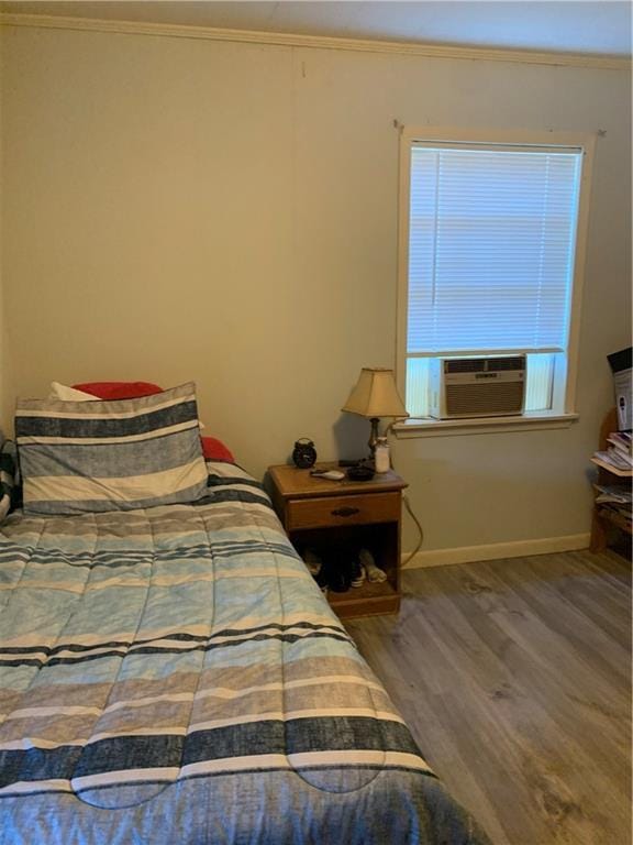 5978 Perryman Ln, Osyka, MS 39657 - bedroom with baseboards, wood finished floors, cooling unit, and ornamental molding