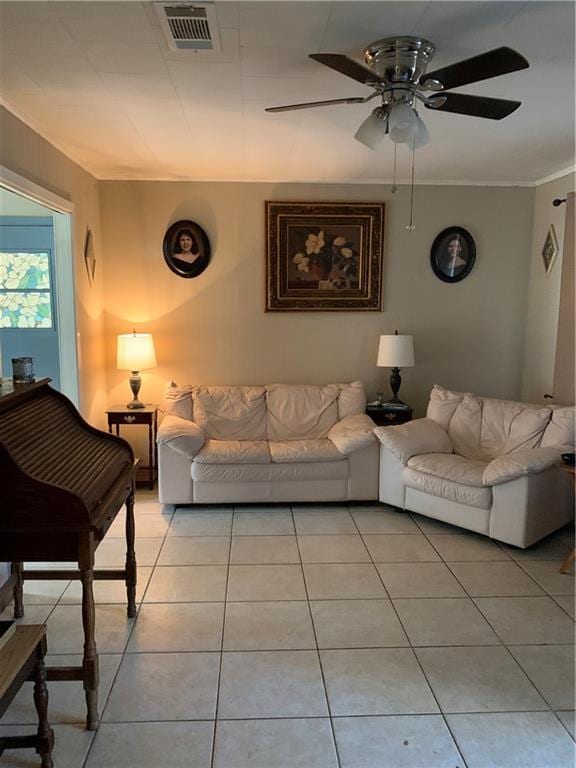 5978 Perryman Ln, Osyka, MS 39657 - living area featuring visible vents, a ceiling fan, ornamental molding, and light tile patterned floors